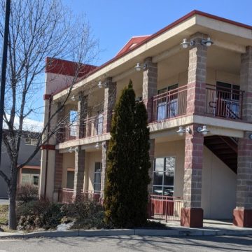 Exterior shot of a building and parking lot